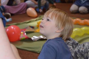 toddler enjoying Signs and Sounds
