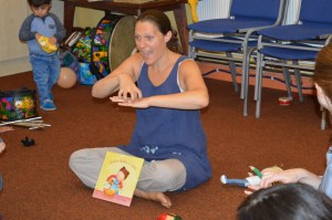 Signs and Sounds leader Rachel Xerri-Brooks signing a story